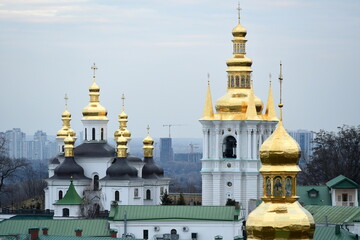 Domes of a church against a blue cloudy sky
