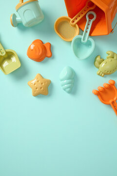 Beach activity background: collection of sand toys flat lay