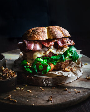 Gourmet burger with bacon, crispy onion and pumpkin bread