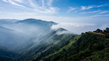 Tranquil morning mist drifting over scenic mountain range with soft light and empty ridgeline space ideal for inspirational text or motivational message placement