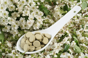 Hawthorn blossoms with tablets as supplement - Background