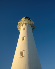 Castlepoint lighthouse at sunset. Wairarapa. New Zealand.