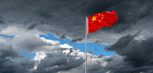 dramatic sky with national flag of China in strong wind