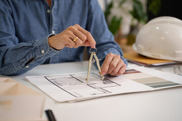 Architect Hands Drafting Blueprint with Compass for House Design Project Adult Asian Hands Using...