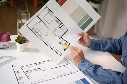 Interior Design Blueprint Hand with Pencil Pointing Floor Plan Reviewing Asian Adult Hands Home Architectural Blueprint Design Project for Creative Renovation
