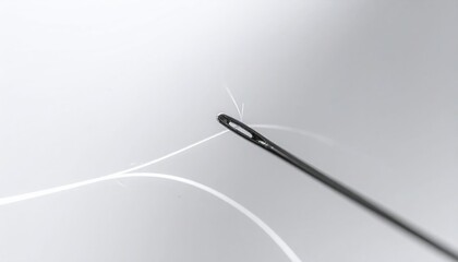 Close Up Needle With Thread On White Background