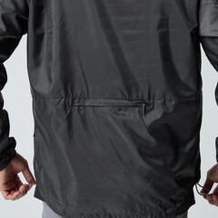 back pocket detail of black windbreaker jacket © NGUYEN