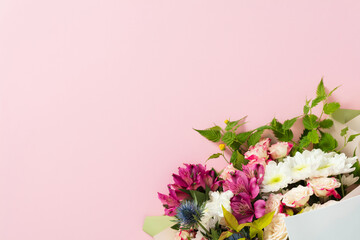 Elegant floral bouquet for wedding or anniversary gift on pink background.