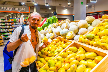 Man goes shopping at the supermarket in Mexico.