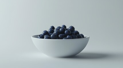 A white bowl filled with blueberries on a light background