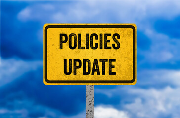 Policies update message written on yellow metal sign. Conceptual policies update symbol. Copy space.