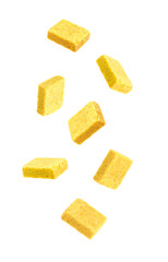 Bouillon cubes in air on white background