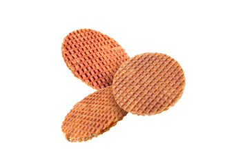 Yummy Dutch waffles (stroopwafels) flying on white background