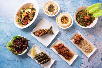 Traditional Lebanese mezze spread with colorful salads, dips, and appetizers.
