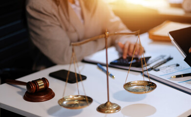 Obraz premium Consultation and conference of lawyers and professional businessman working and discussion having at law firm in office. Concepts of law, Judge gavel with scales of justice.