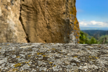stone rocky pedestal or podium on rocky mountain landscape. empty product presentation background