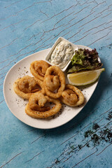 Golden fried calamari and shrimp rings served with tartar sauce.