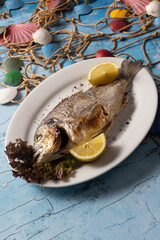 grilled fish, whole fish, seafood, lemon, sea bream, dorado, food photography, rustic, gourmet,...