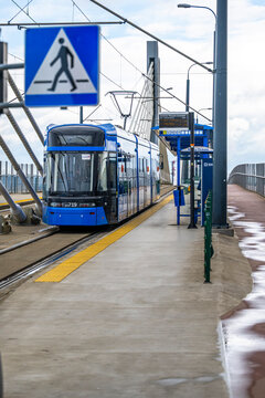 Krakow, Poland - May 18, 2025: Tram on the viaduct above the Krakow Plaszow station.