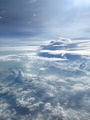 Fototapeta premium Sunlight filtering through majestic cloudscape, creating a breathtaking view from above