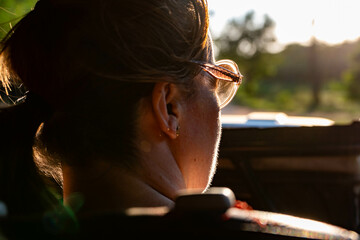 woman in a safara jeep in yala national park, sri lanka