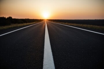 A quiet road at sunset with no traffic or people in sight