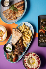 Traditional Lebanese mezze and grill platter with colorful, vibrant presentation.