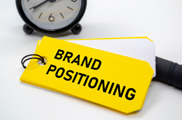 Branding positioning text in bold black font on yellow sticky note.