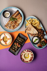 Traditional Lebanese mezze and grill platter with colorful, vibrant presentation.