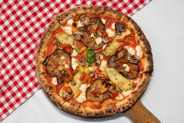 Wood-fired vegetable pizza topped with grilled zucchini, eggplant, and mushrooms.
