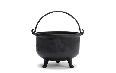 Isolated view of a vintage black iron cauldron on white background