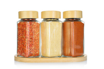 Many different aromatic spices in jars isolated on white
