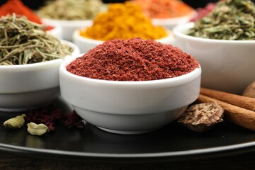 Many different aromatic spices on table, closeup