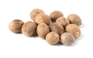 Pile of fresh nutmegs isolated on white