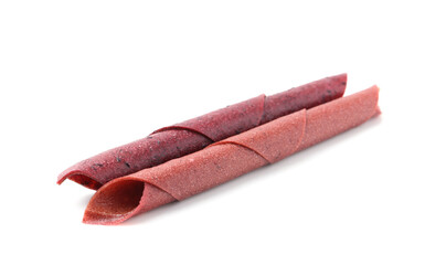 Delicious fruit leather rolls on white background