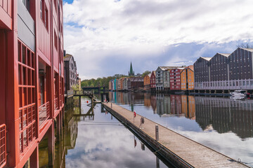 Colorful historical fishing houses of Trondheim, Norway,  Nidaros cathedral in the background