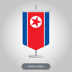 North Korea vertical table flag on light grey background. North Korea vertical desk flag isolated on grey background	
