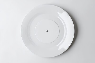 A white dinner plate with a smaller, white vinyl record centered inside