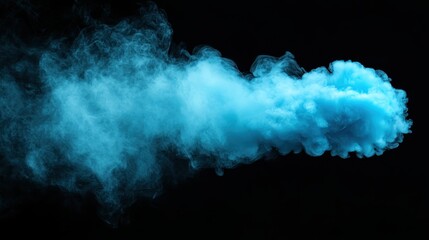 Naklejka premium A vibrant cloud of blue smoke gracefully flows against a dark background, creating an ethereal and captivating visual experience filled with mystery and intrigue.