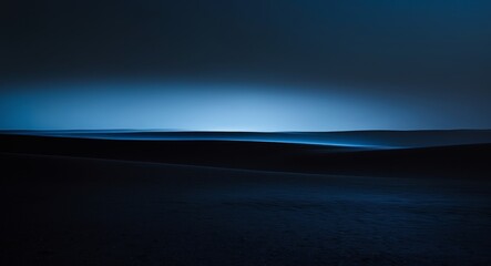 Fototapeta premium Ethereal Blue Sand Dunes at Night, A Mysterious and Tranquil Landscape Photography