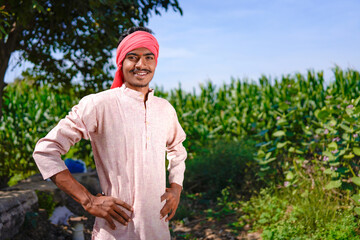 Fototapeta premium indian farmer standing confidently at agriculture field