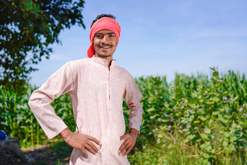 Fototapeta premium indian farmer standing confidently at agriculture field