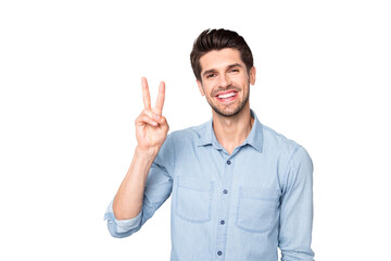 Portrait of positive cheerful guy have fun with his friends on weekend make v-signs wear casual...