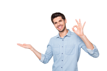 Portrait of positive cheerful promoter man hold hand demonstrate adverts present feedback recommend perfect novelty show ok sign wear casual style clothes isolated over grey color background