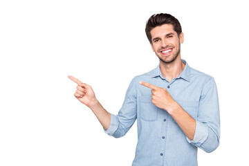 Portrait of positive cheerful man promoter point index finger indicate suggest promo ads wear casual style clothes isolated over grey color background