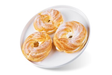 Cottage cheese rings with powdered sugar topping in the plate on a white isolated background