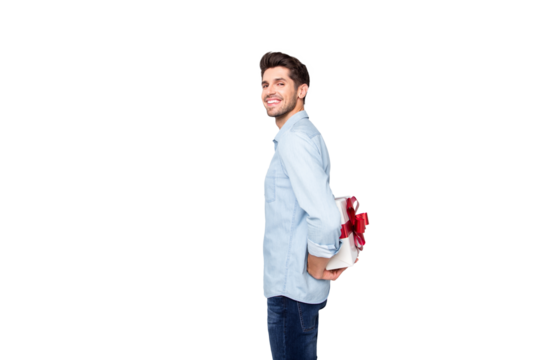 Profile side photo of positive cheerful lover man hide prepared gift box for girlfriend want give on valentine date holidays stand copyspace wear stylish trendy outfit isolated grey color background