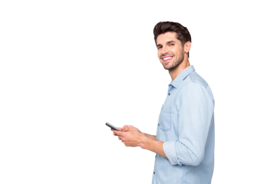 Profile side photo of positive cheerful man using holding his mobile phone have online conversation with friends on social media at copyspace wear stylish outfit isolated over grey color background - Powered by Adobe