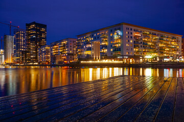 City at body of water during night
