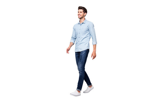 Full size turned photo of positive cheerful man have free time fun go walk want meet university friends wear casual style clothes isolated over grey color background